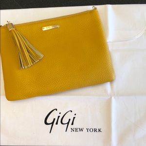 Gigi NewYork mustard colored textured clutch